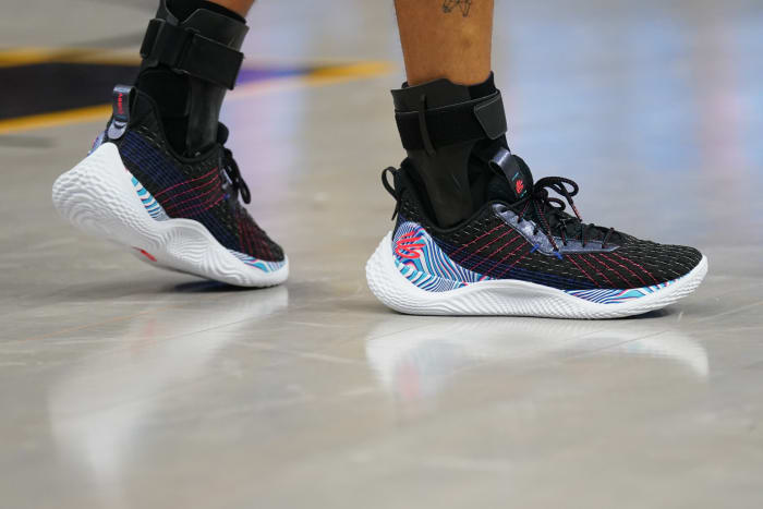 Black, blue, and white Curry shoes.
